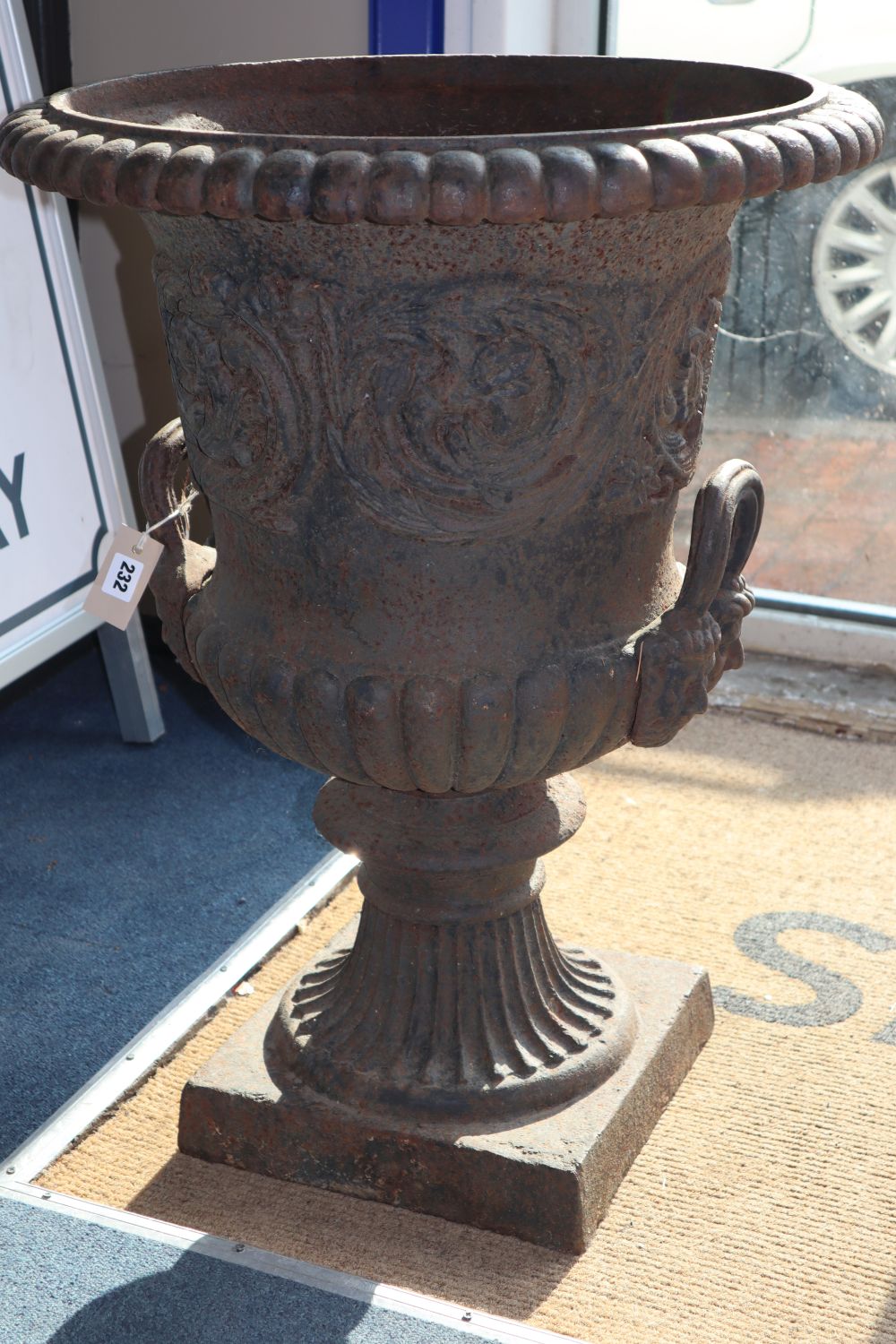 A pair of Victorian cast iron campana-shaped urns, H.74cm, diameter 56cm